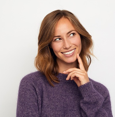 Woman smiling with dental implants in Kansas City