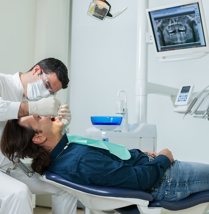 dentist working on a patient’s mouth