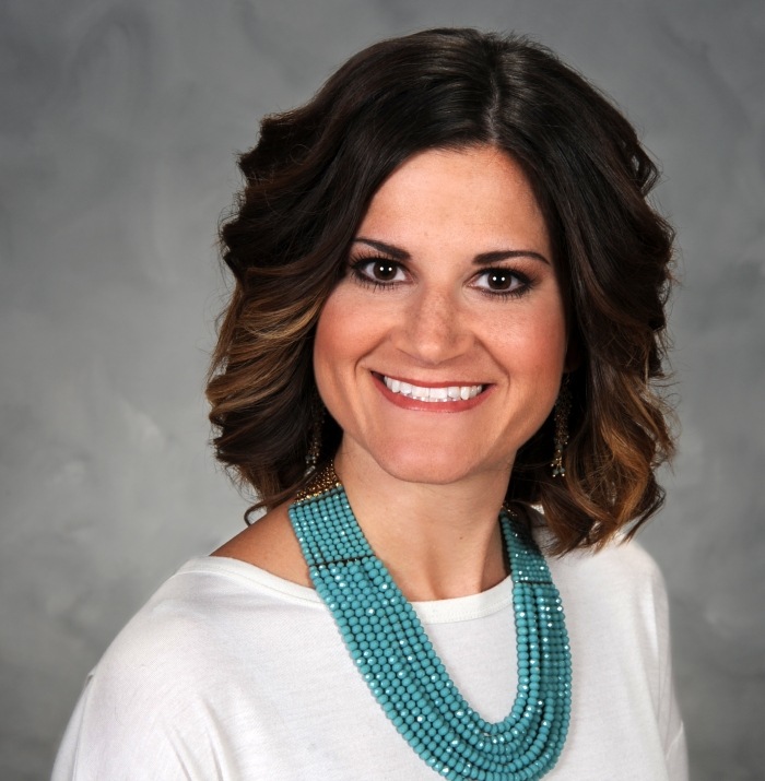 Kansas City dental patient wearing a blue necklace