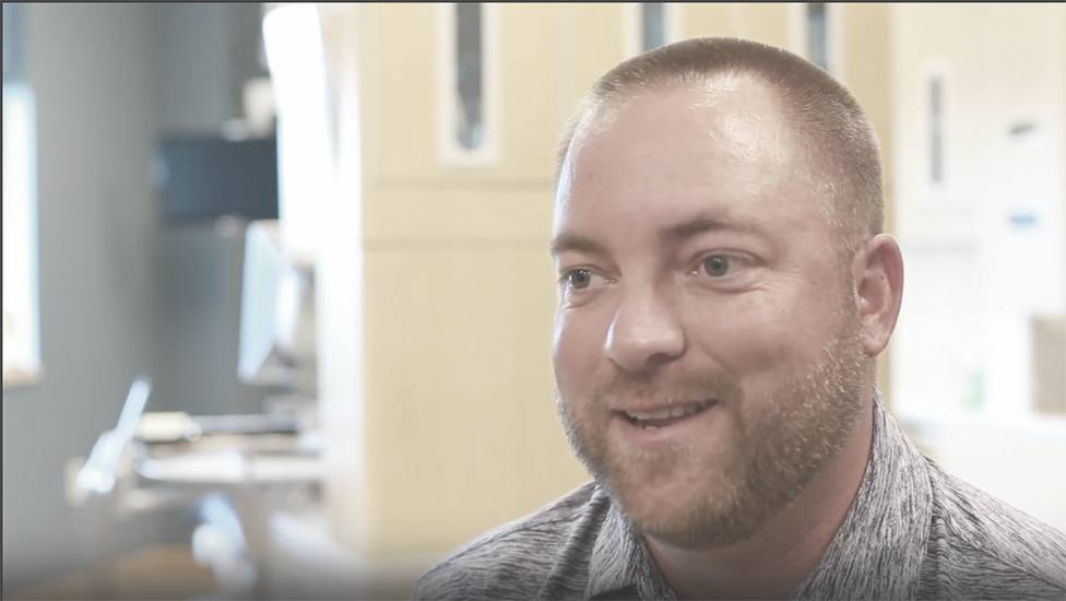 Kansas City dental patient in heathered shirt