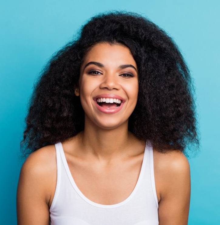 young woman smiling with veneers in Kansas City