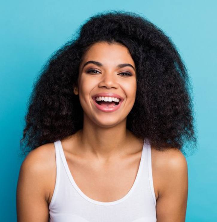 young woman smiling with veneers in Kansas City 