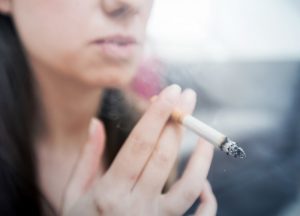 a woman smoking a cigarette