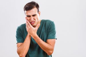 man with mouth pain