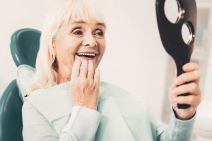 woman happy with her new dentures