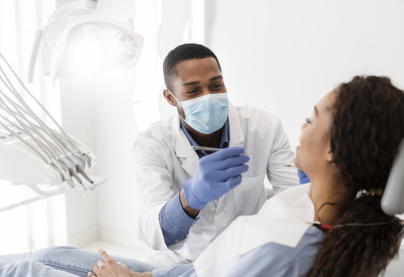 dentist and patient during dental checkup