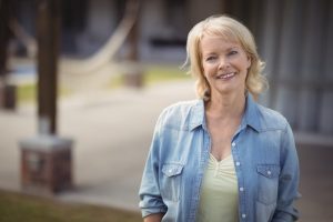 Woman smiling outside with beautiful teeth