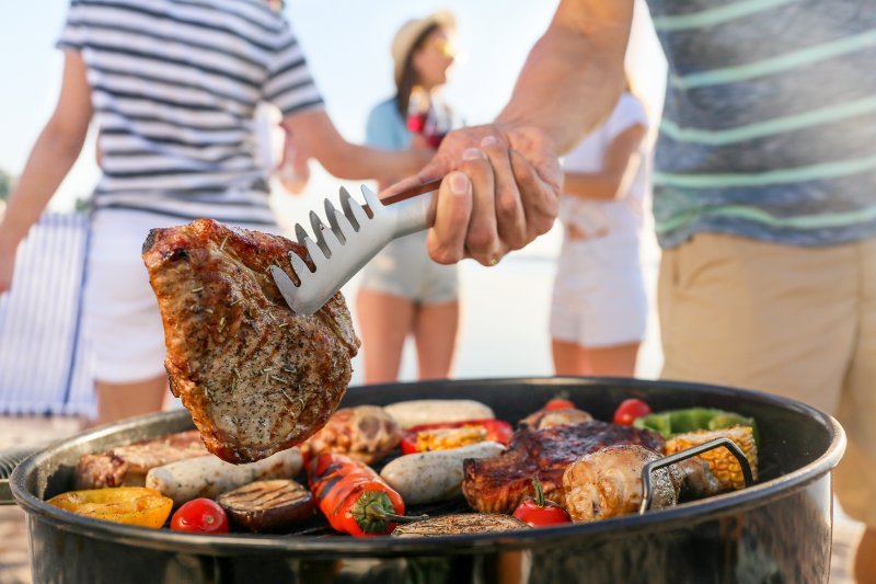 Man grilling some food during the summer