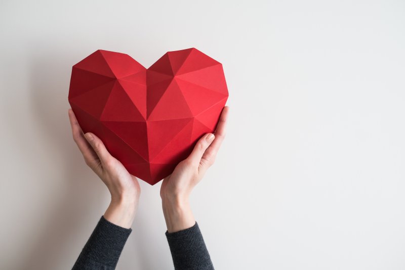 Picture of someone cradling a foam heart