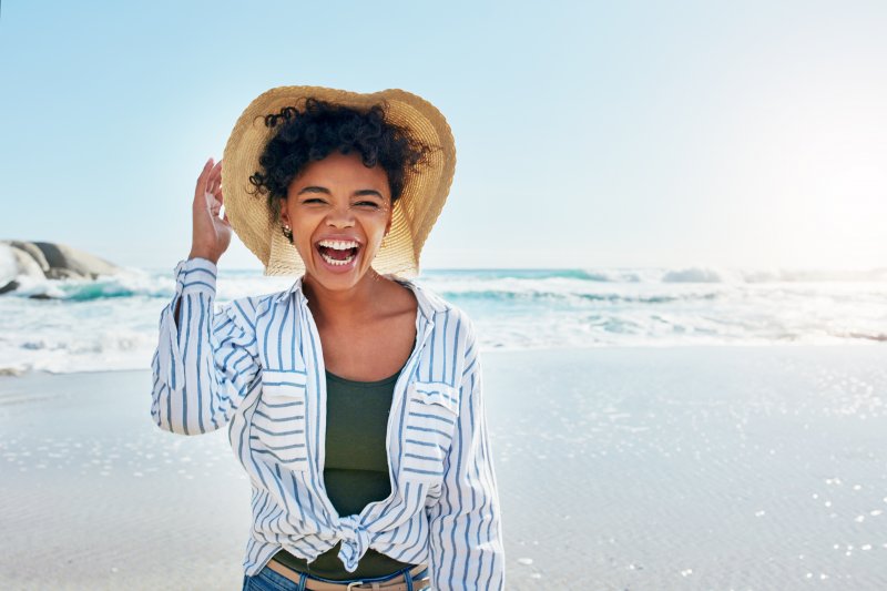 A smiling woman enjoying their summer vacation