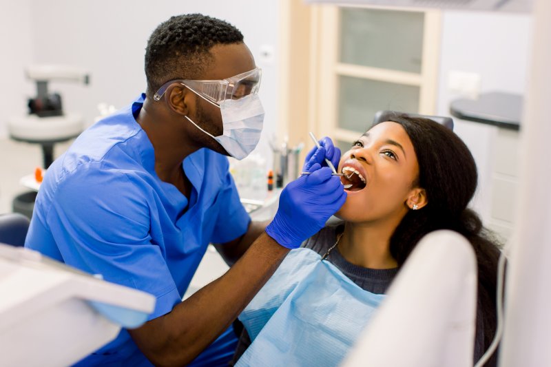 Teenager talking to their dentist